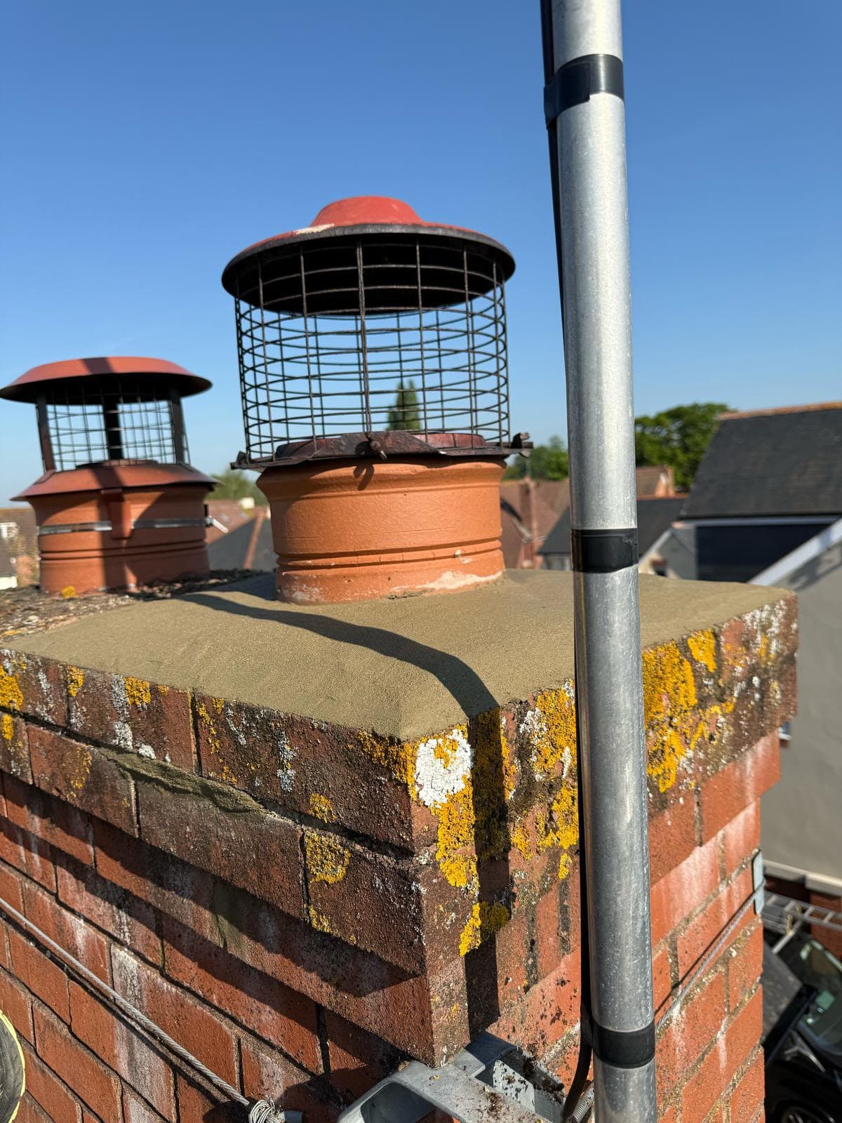 Chimney pots and cowls above a pitched roof
