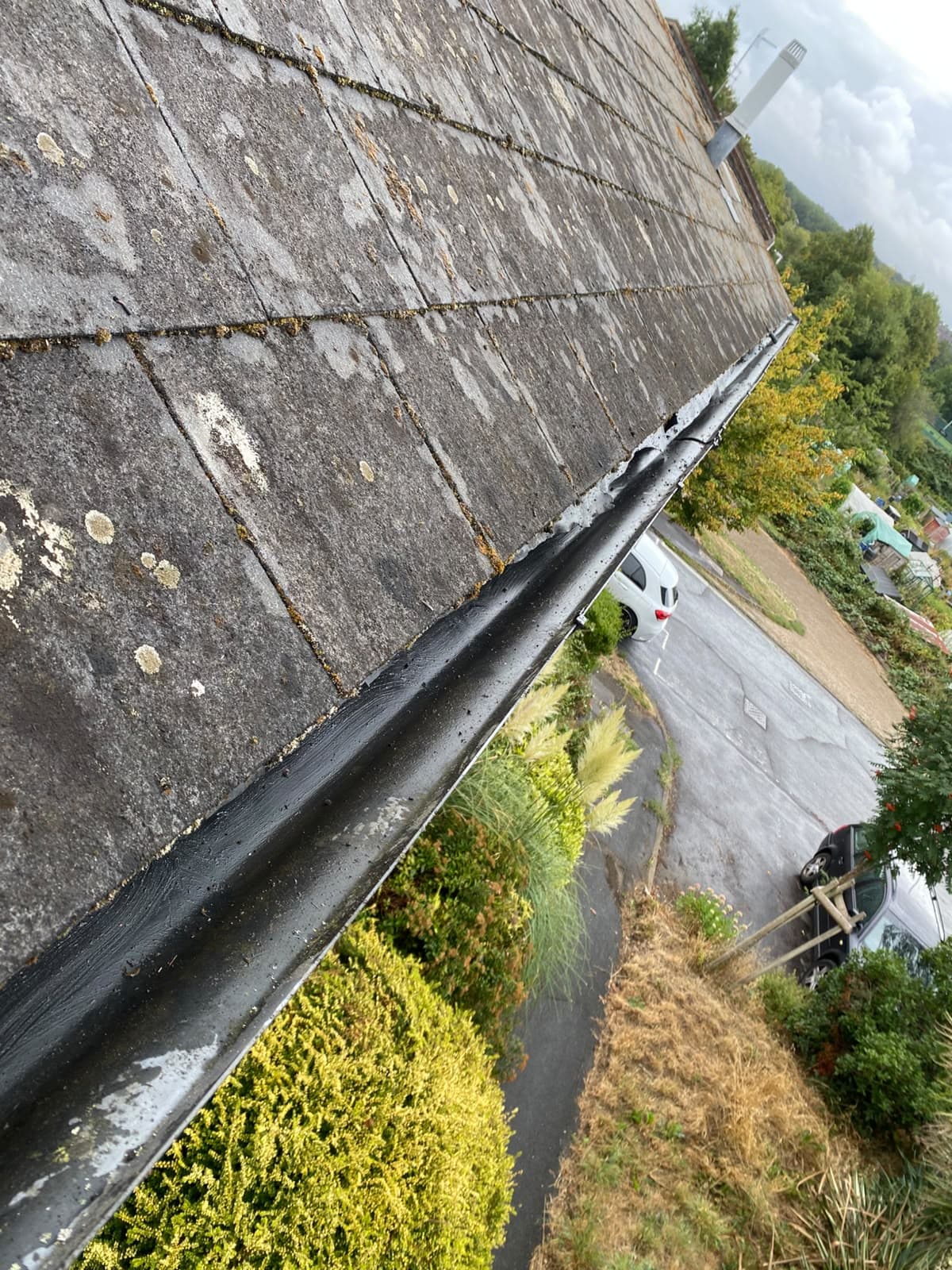 Guttering along a pitched roofline
