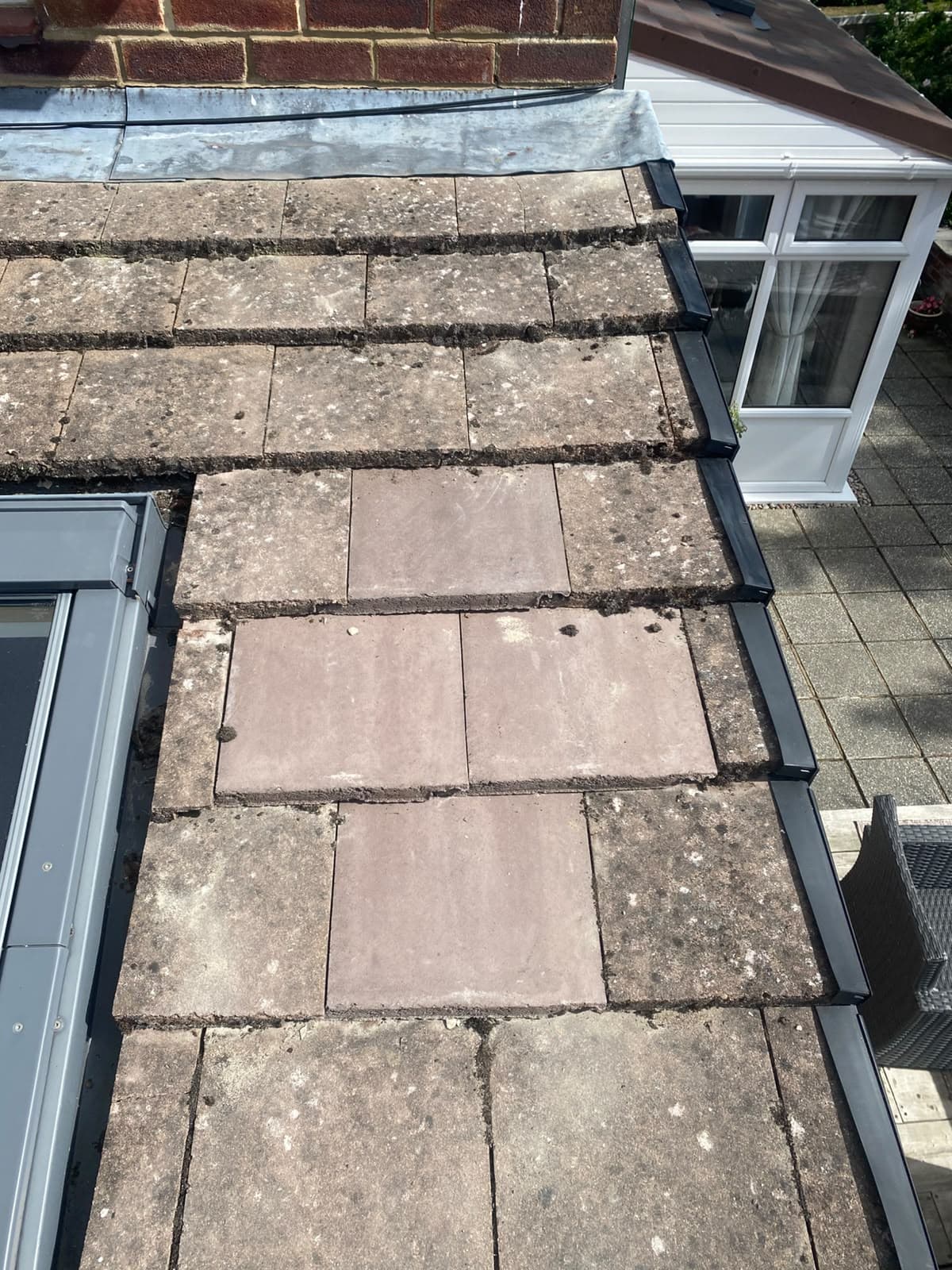 Tiles and flashing around a roof window
